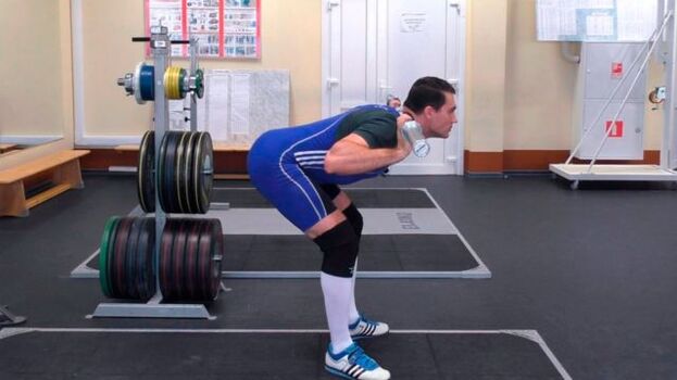 A man performs bending movements to achieve a stable erection